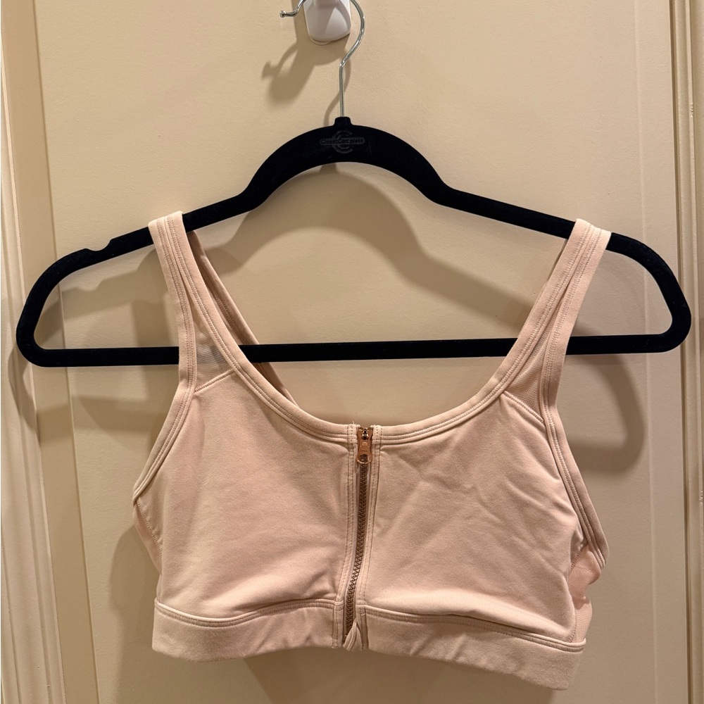 Pink zip front sports bra